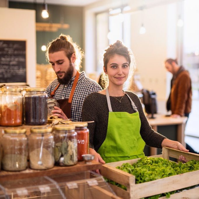 Couple working in a bulk food store